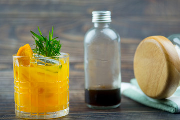 Glass of orange juice with ice cubes