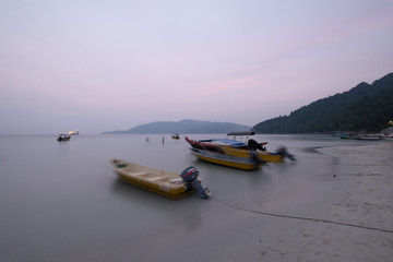 Fototapeta premium Pulau Perhentian, Terengganu - August 14th, 2018 : Beautiful view of small Perhentian Island with multiple boats. Perhentian Island is the most favourite holiday destination among locals and tourists