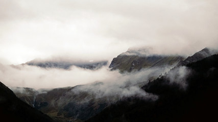 on a rainy day view to the foggy alps