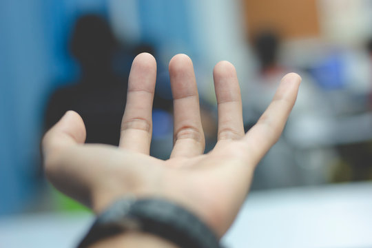 hand of man pointing at something on green screen - Powered by Adobe