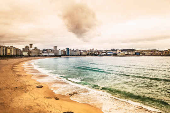 view of the solitary beach of riazor in a Coru&ntilde;a , Spain at sunset