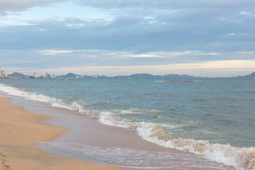Sand beach water surf. Blue sea wave.
