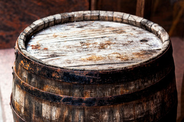 Old rusty barrel 1969 in a cellar room