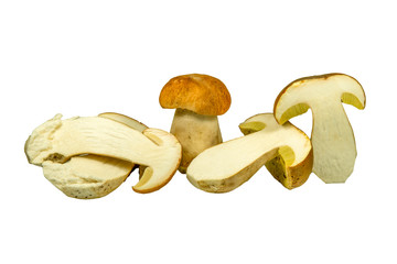 Whole and sliced halved Boletus mushrooms on white