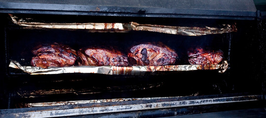 Beef brisket in bbq smoker.