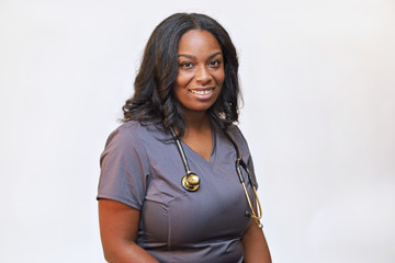 Portrait of an attractive female healthcare professional against a white background with copy space, photo of a woman nurse, medical staff