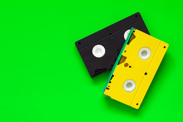Video tapes on green background