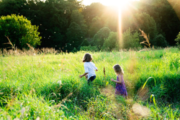 Children Playing with Bubbles at Sunset