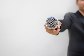 reporter holding microphone for interview
