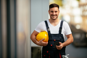 Portrait of young worker in uniform