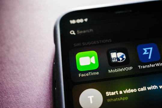 Paris, France - Jan 30, 2018: Apple iPhone XS with FaceTime app icon on the display next to MobileVoip call