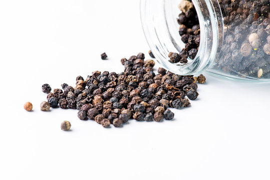 Close-up image of black pepper isolated on white background