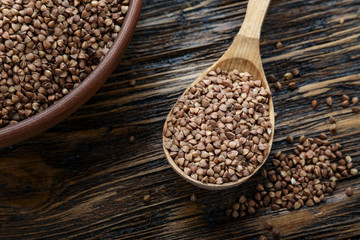 raw buckwheat in a clay plate