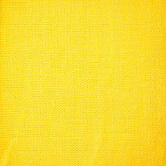Crochet pattern. Closed up details of the knitted yellow winter sweater pattern.
