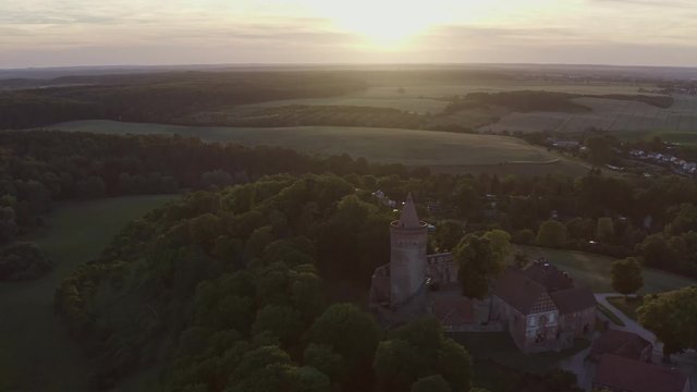 Aerial Shot of Castle in front of sunset in Germany Mecklenburg Vorpommern - Burg Stargard