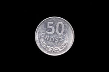 Polish People's Republic, Polska Rzeczpospolita Ludowa old 50 groszy coin from 1977, reverse. Isolated on black background
