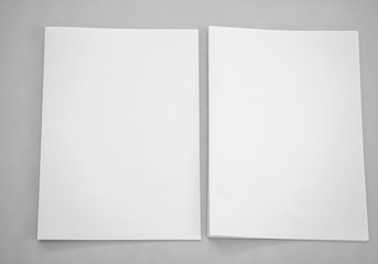 Top view of blank sheet of paper on gray background. mock-ups paper, white paper portrait A4. brochure magazine isolated, use banners products business cards to showcase your.