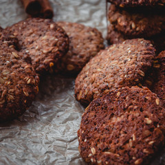 Homemade healthy oat cookies with cinnamon on brown parchment. Healthy food concept. Healthy snack