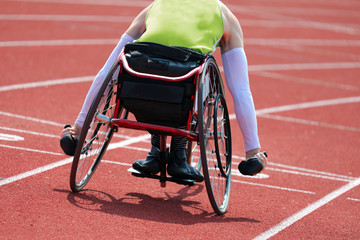 Athlete runs with wheelchair
