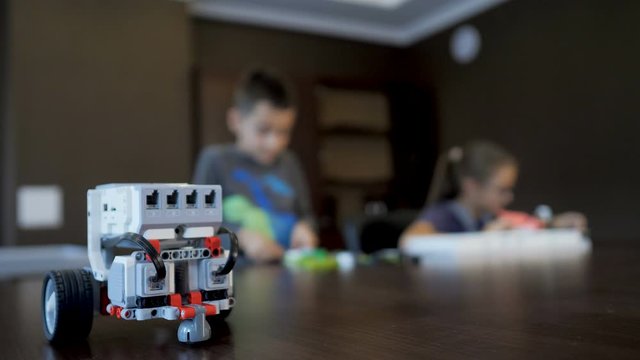Children in the classroom make figure from the designer