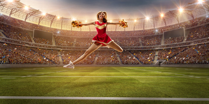 A cheerleader in action on the professional stadium. Stadium and crowd are made in 3d.