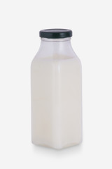 Fresh Bottle of Milk on White Background