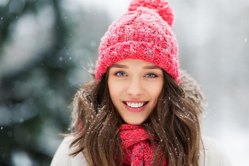 people, season and christmas concept - portrait of happy smiling teenage girl or young woman...