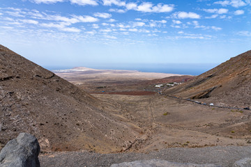 From the mountains near Femes, you have a beautiful view of the seaside village Playa Blanca, Lanzarote, Spain