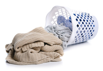 bin with clothing on white background isolation