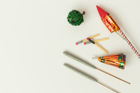 Different types of Diwali Firecrackers on isolated background with copy space.