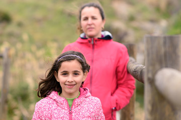 Fototapeta premium Mother and daughter, happy in the countryside on a winter day