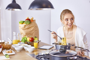 Young Woman Cooking in the kitchen. Healthy Food