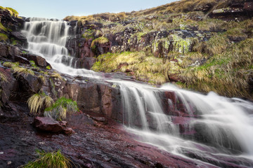 Scenic, colorful, powerful Monk's jump waterfall on Old mountain, the tallest in Serbia, streaming down the dark, rocky cliff