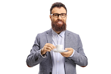 Cheerful bearded man with a cup of espresso coffee looking at the camera