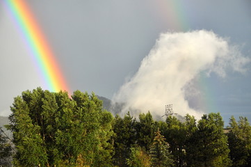 rainbow, trees and drifting cloud