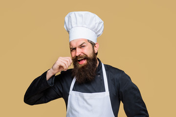 Cook man in chef uniform. Professional chef man. Cooking, profession, business. Professional man chef ready to cook new dish. Chef, cook, baker in hat and apron. Chief cook and professional culinary.