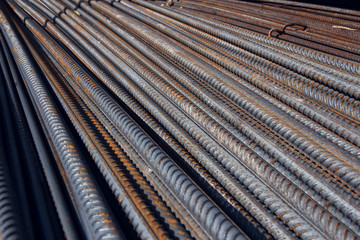 Industrial background. Brand new steel rebars at a construction site. Preparation for pouring concrete. Construction of buildings of reinforced concrete.