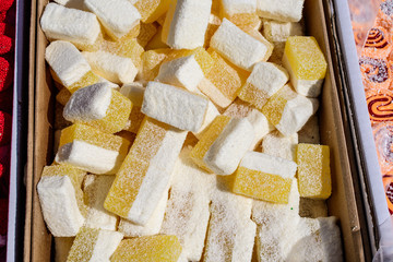 Bunch of traditional Turkish delight or lokum displayed for sale at an weekend street food market