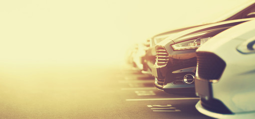 luxury cars on dealership parking in selective focus