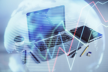 Stock market chart with globe hologram and desktop office computer background. Multi exposure. Concept of financial analysis.