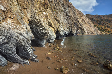 Stone cliff and Sandy beach on the island of Zakynthos in Greece.