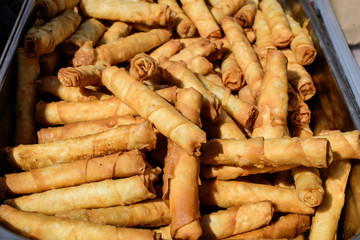 Traditional Turkish fried feta rolls called Sigara Boregi or borek, made of cheese, ready to eat and available for sale at a street food market