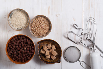 Flakes, sugar, seeds semi-cook for porridge close up in white key