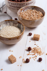Flakes, sugar, seeds semi-cook for porridge close up in white key