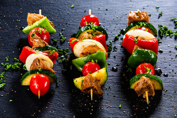 Grilled shashliks with chicken on blask stone plate © Jacek Chabraszewski