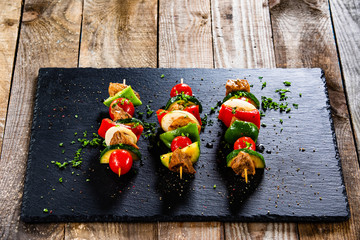 Grilled shashliks with chicken on blask stone plate © Jacek Chabraszewski