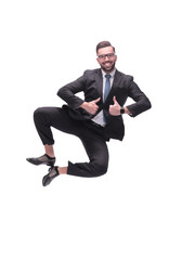 in full growth. happy dancing young businessman