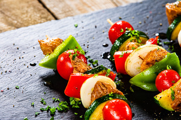 Grilled shashliks with chicken on blask stone plate © Jacek Chabraszewski