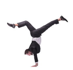 in full growth. happy young businessman dancing break dance