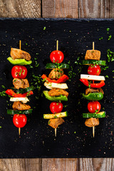 Grilled shashliks with chicken on blask stone plate © Jacek Chabraszewski